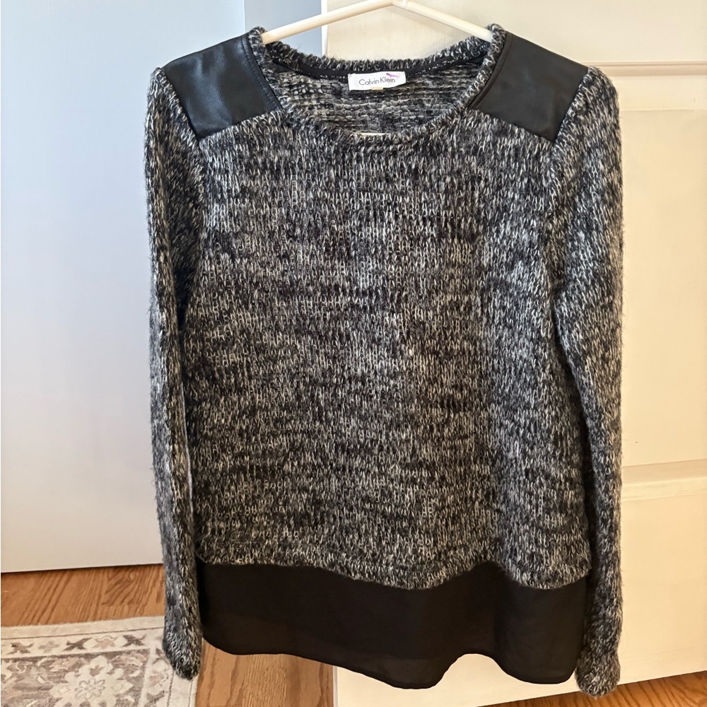 Sweater with leather shoulder detail and sheer bottom fabric